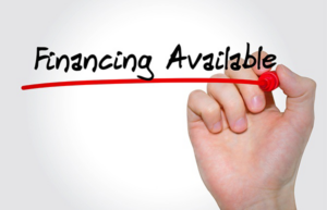 A business offering financing options, as indicated by a person writing 'Financing Available' on a whiteboard.